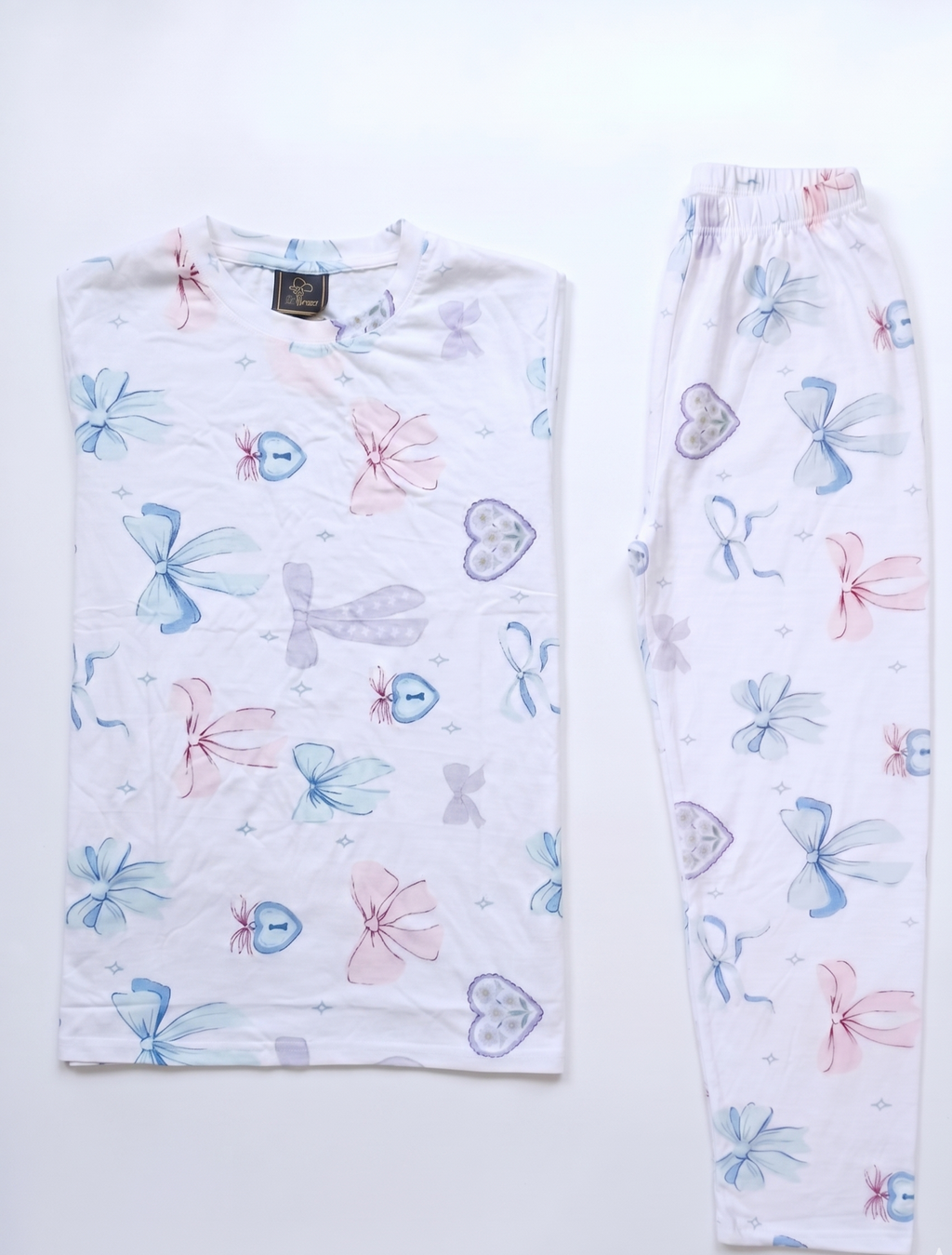 Pair of pajama pants with colorful butterfly pattern on a white background