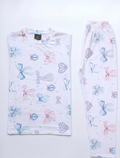 Pair of pajama pants with colorful butterfly pattern on a white background