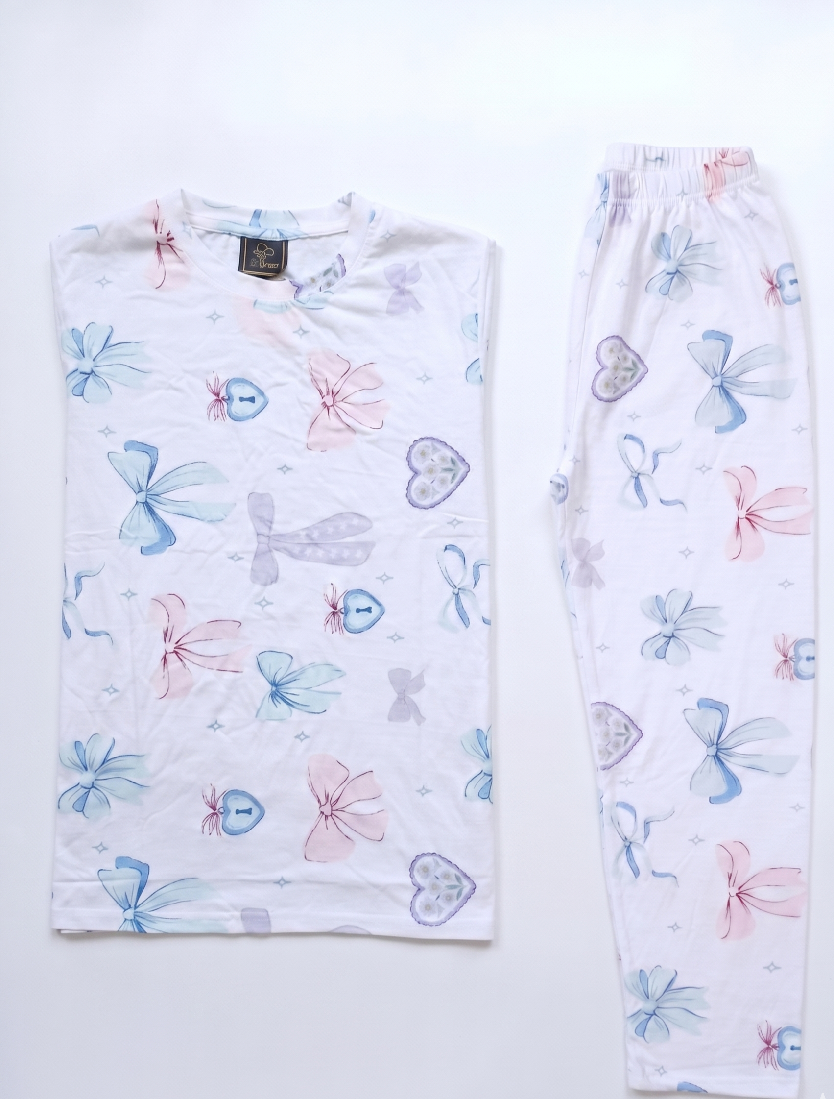 Pair of pajama pants with colorful butterfly pattern on a white background